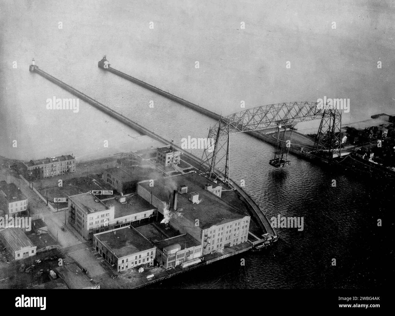 AIRSCAPES Minnesota Taken by McCook Field, during Mapping of Canadian Border, Oct. & Nov. 1925 Duluth Harbor Basin, the main business section and portions of Lake Superior, showing the 'Eighth Wonder of the World', the aerial bridge connecting Duluth proper with a long neck of land known as Minnesota Point, which really makes the Duluth Superior Harbor. Stock Photo