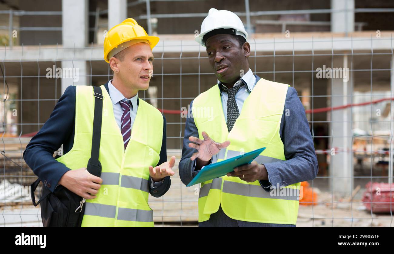 Two architects discussing construction project Stock Photo