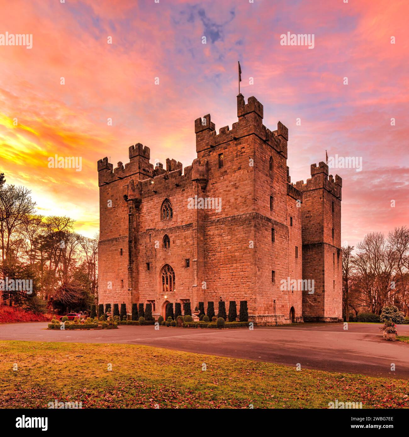 An external daylight view in summer at sunset of Langley Castle Hotel near Haydon Bridge in Northumberland with a lovely colourful sky backdrop Stock Photo