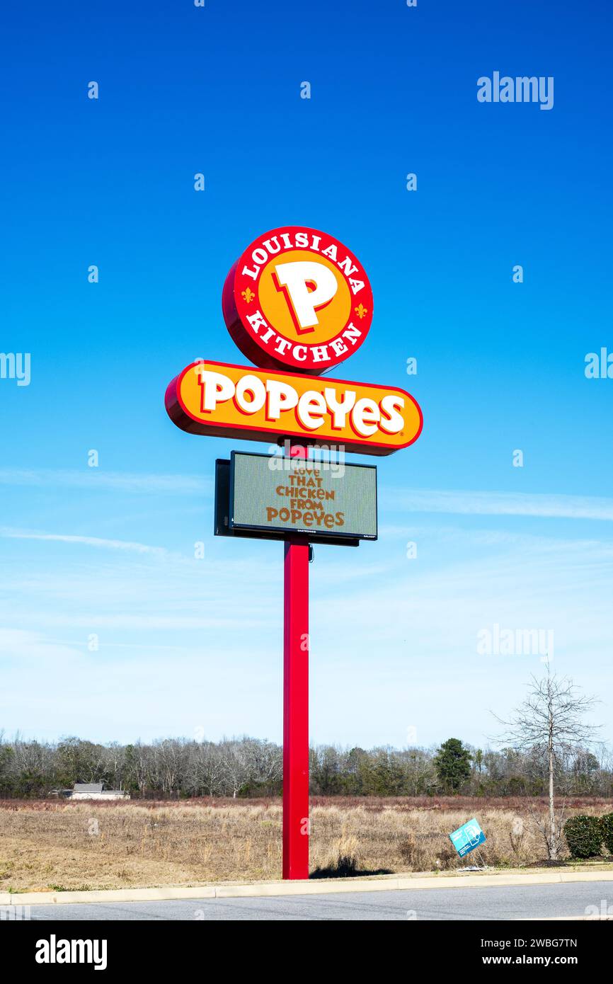 Popeyes Louisiana Kitchen, sign and logo, fast food restaurant serving chicken and other food in Montgomery Alabama, USA. Stock Photo