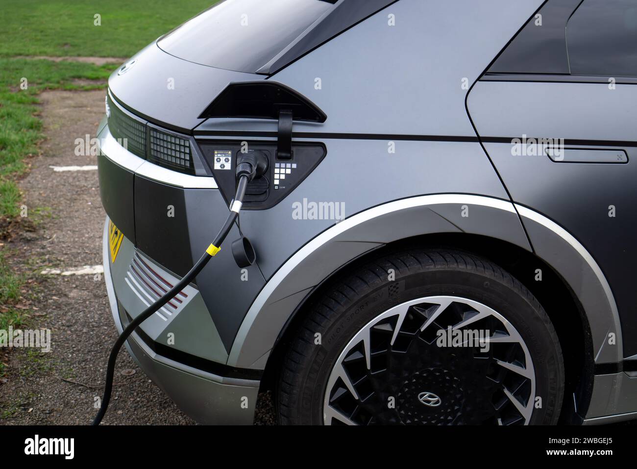 Hyundai Ioniq 5 electric car close-up using an EV charging point Stock Photo
