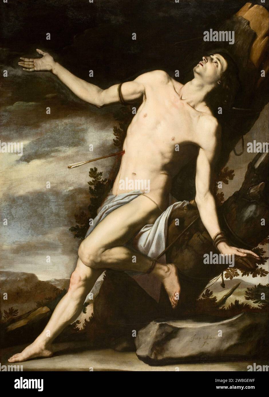 The Martyrdom of St Sebastian painted by Jusepe de Ribera. Sebastian was a member of the Roman Praetorian Guard who converted to Christianity. He was shot through with arrows but did not die from these wounds. He was tended by Irene (later Saint Irene). After his recovery he went to speak to Emperor Diocletian of his faith and was beaten to death. Stock Photo