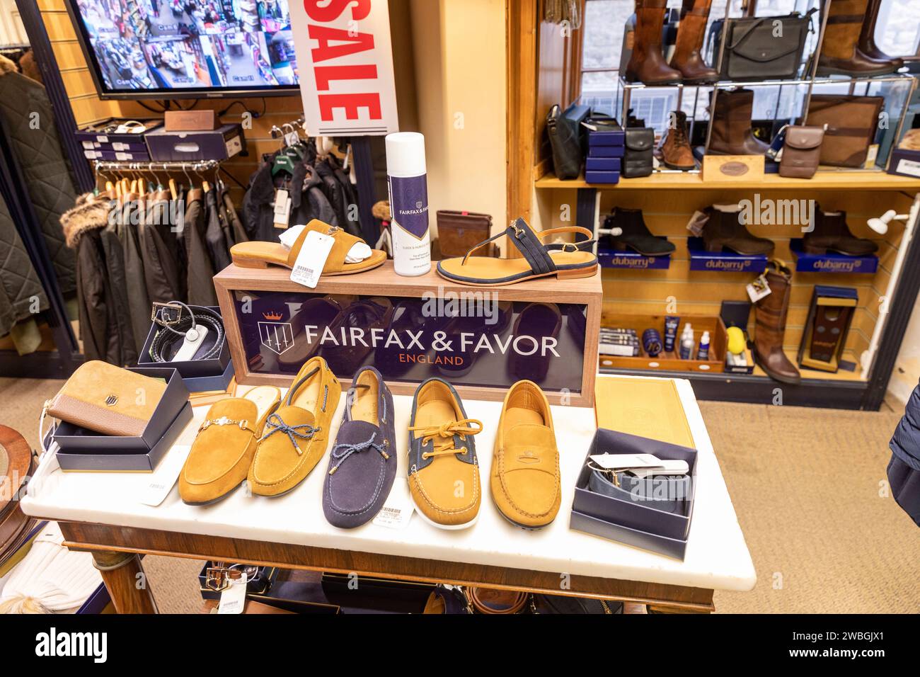 Fairfax & Favor luxury British retailer, store interior with shoes and boots available for sale prices, Cotswolds,England,UK,2023 Stock Photo