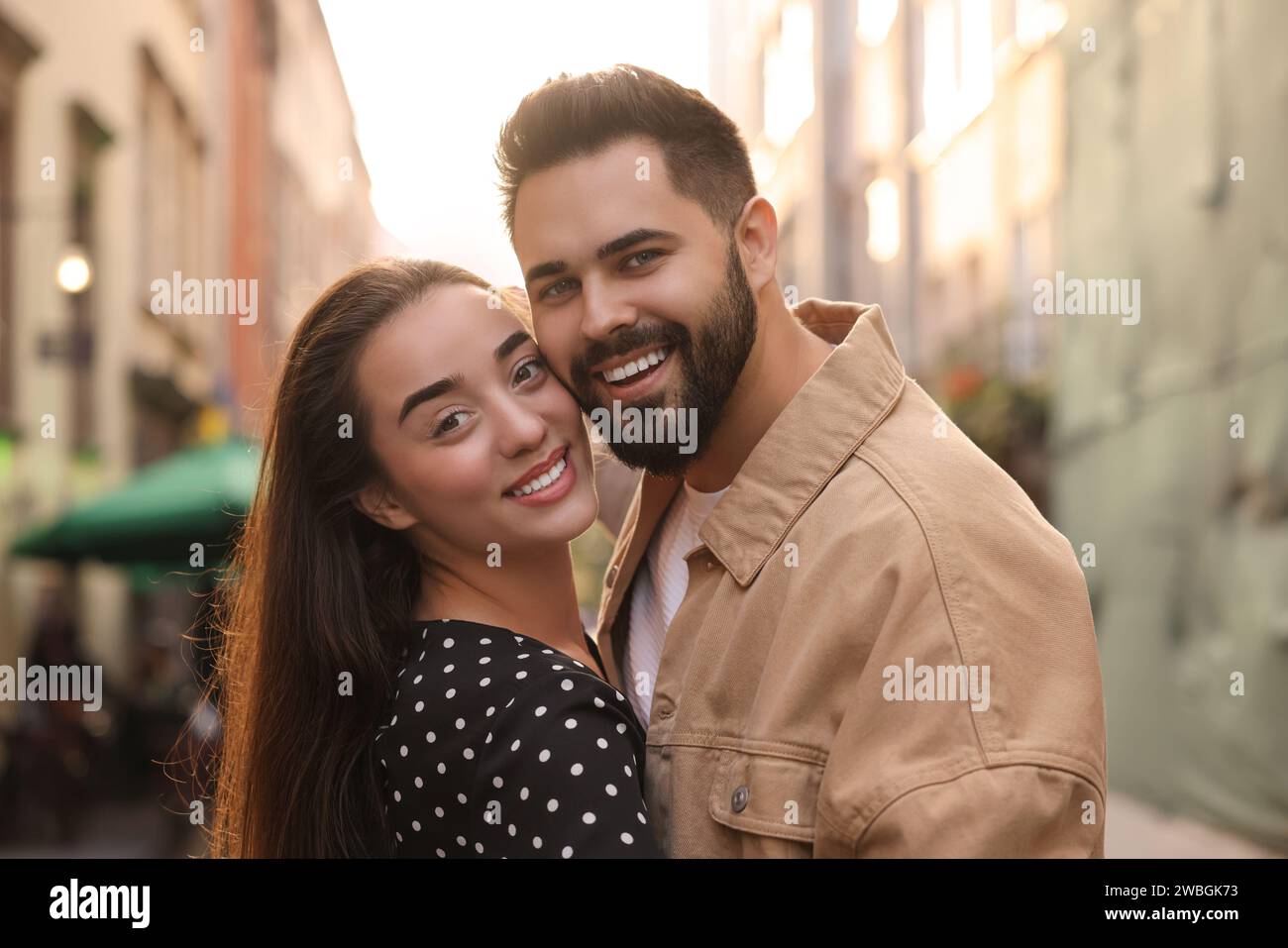 Lovely couple dancing together on city street Stock Photo - Alamy
