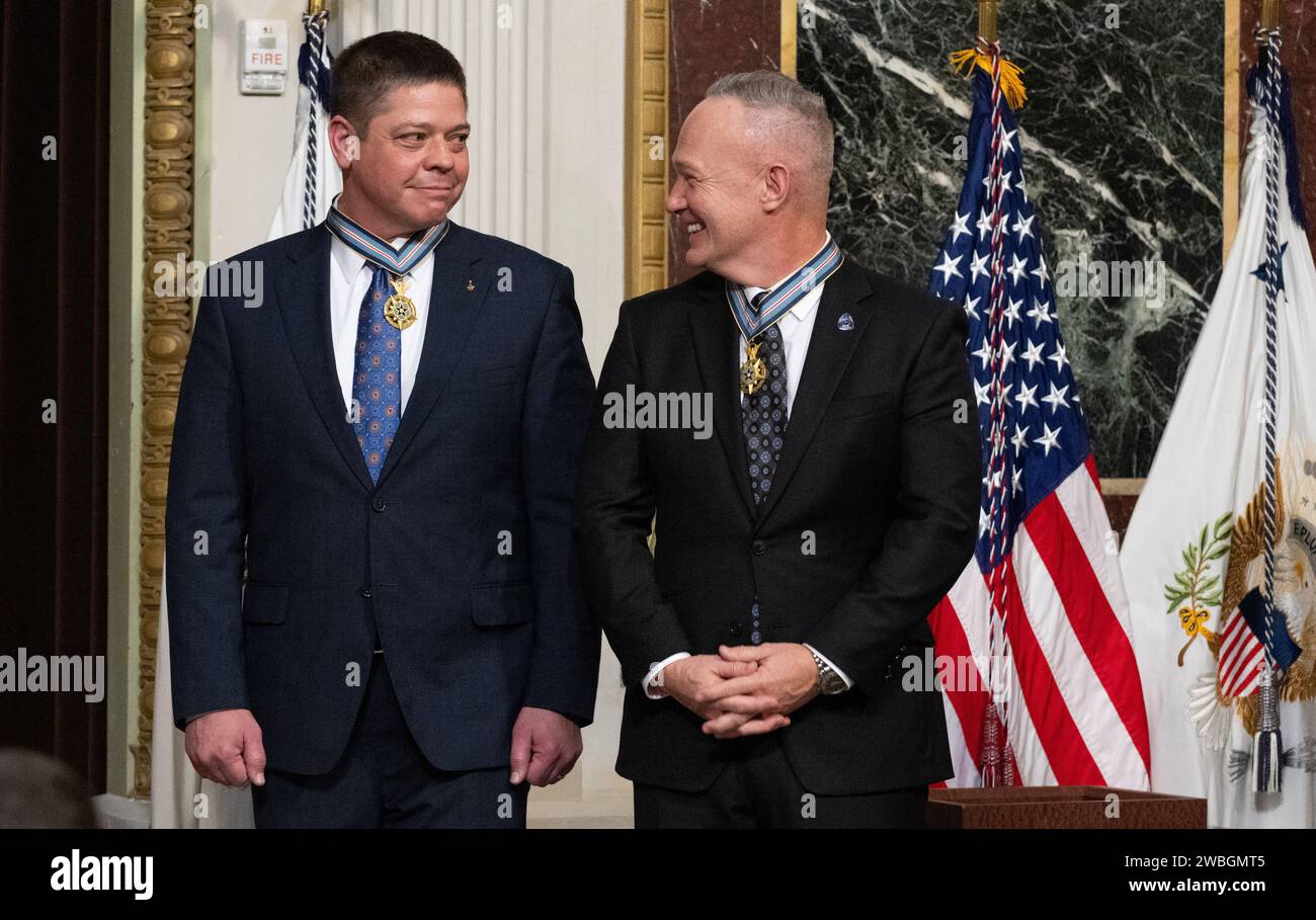 Former NASA astronauts Robert Behnken, left, and Douglas Hurley, right, are seen after being awarded the Congressional Space Medal of Honor by Vice President Kamala Harris during a ceremony in the Indian Treaty Room of the Eisenhower Executive Office Building, Tuesday, Jan. 31, 2023, in Washington. Former astronauts Behnken and Hurley were awarded the Congressional Space Medal of Honor for their bravery in NASA’s SpaceX Demonstration Mission-2 to the International Space Station in 2020, the first crewed flight as part of the agency’s Commercial Crew Program. Photo Credit: (NASA/Joel Kowsky) Stock Photo