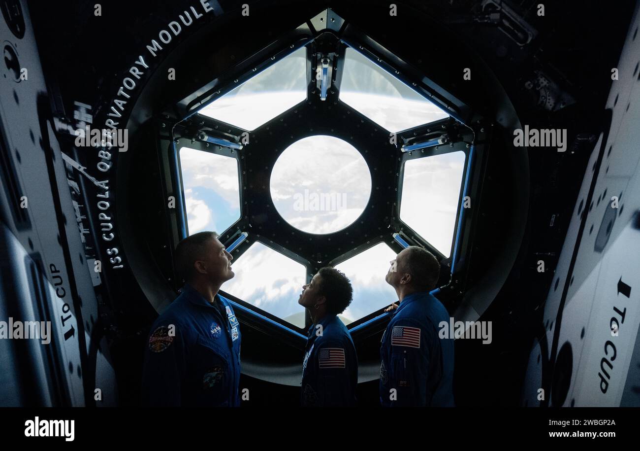 NASA astronauts Kjell Lindgren, left, Jessica Watkins, center, and Robert Hines, right, are seen in the in the One World Connected gallery looking at an interactive recreation of the International Space Station’s Cupola, Tuesday, March 28, 2023 at the Smithsonian’s National Air and Space Museum in Washington. Lindgren, Watkins, and Hines spent 170 days in space as part of Expeditions 67 and 68 aboard the International Space Station. Photo Credit: (NASA/Joel Kowsky) Stock Photo