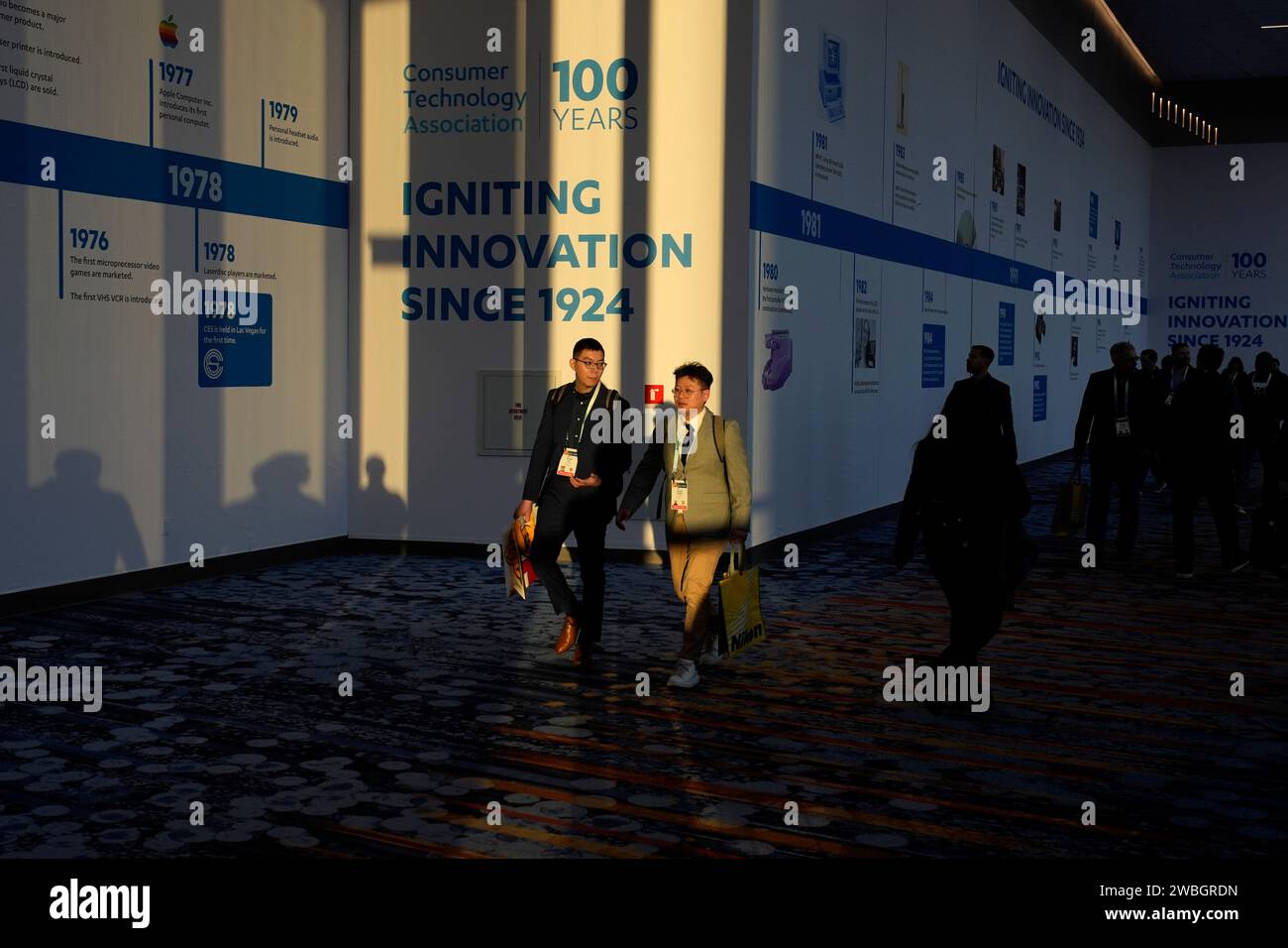 People walk through the Las Vegas Convention Center during the CES tech ...
