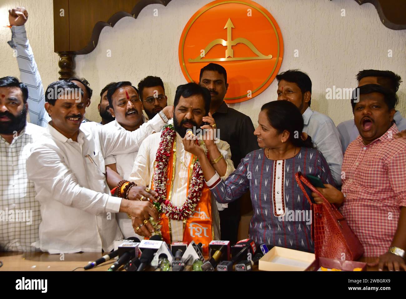 MUMBAI, INDIA - JANUARY 10: Shiv Sena (Shinde faction) MLA Bharat Gogawale with party leaders celebrate after the Shiv Sena MLA disqualification case verdict, at Balasaheb Bhavan on January 10, 2024 in Mumbai, India. The Maharashtra Legislative Assembly Speaker Rahul Narwekar today held that Eknath Shinde led faction was the real Shiv Sena when the rival faction emerged within the party on June 22, 2022. He has refused to disqualify any member from both the factions, led by Shinde and Uddhav Thackeray. Both the factions had filed 34 petitions against each other before the speaker in 2022, se Stock Photo