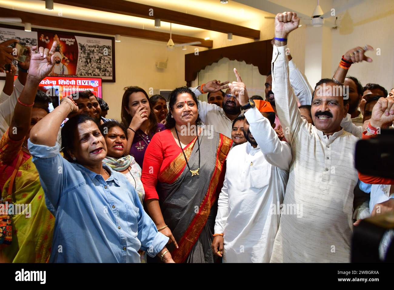 MUMBAI, INDIA - JANUARY 10: Shiv Sena (Shinde faction) workers celebrate after the verdict in the MLA disqualification case came in the favour, at Balasaheb Bhavan on January 10, 2024 in Mumbai, India. The Maharashtra Legislative Assembly Speaker Rahul Narwekar today held that Eknath Shinde led faction was the real Shiv Sena when the rival faction emerged within the party on June 22, 2022. He has refused to disqualify any member from both the factions, led by Shinde and Uddhav Thackeray. Both the factions had filed 34 petitions against each other before the speaker in 2022, seeking the disqu Stock Photo