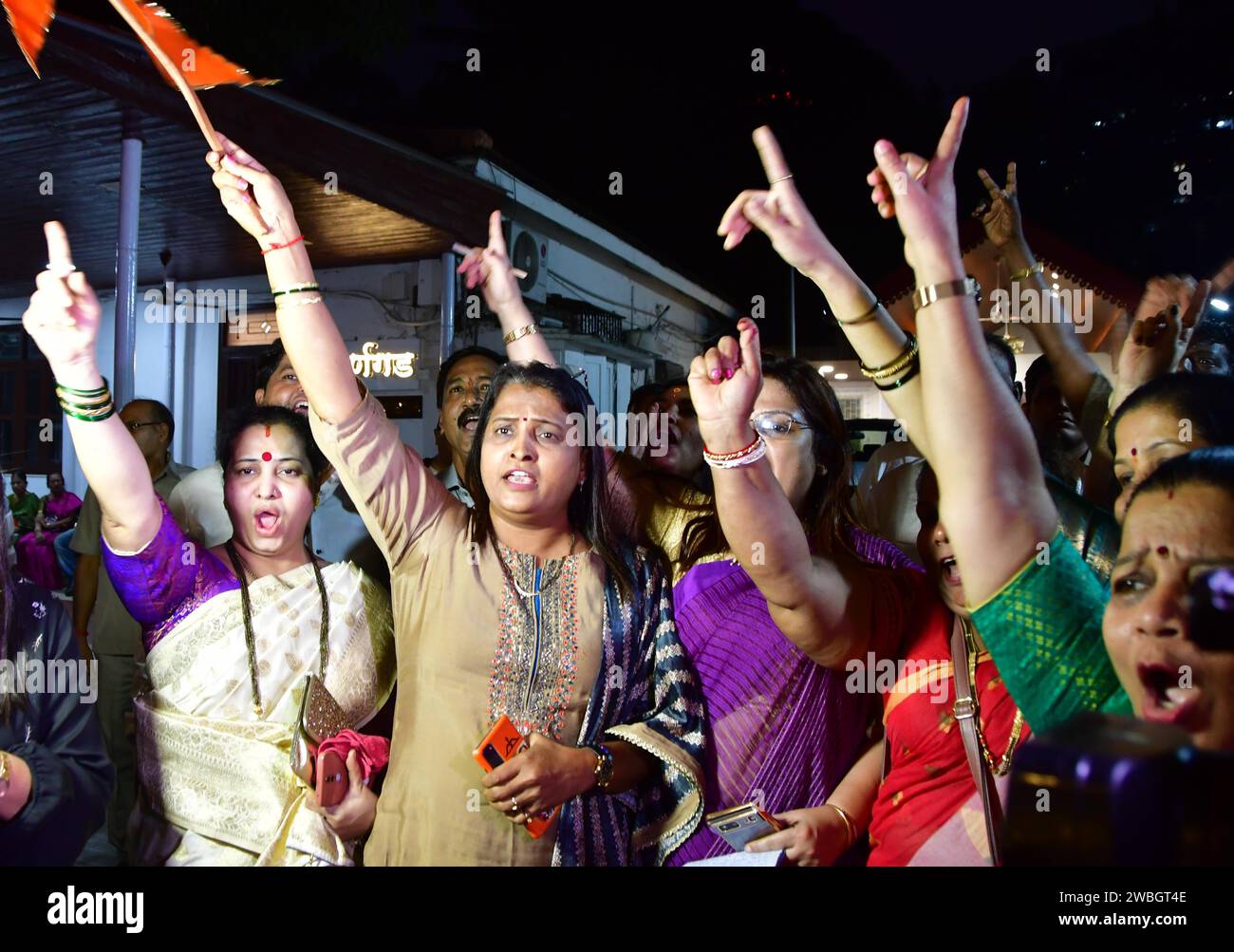 MUMBAI, INDIA - JANUARY 10: Shiv Sena (Shinde faction) workers celebrate after the verdict in the MLA disqualification case came in the favour, at Balasaheb Bhavan on January 10, 2024 in Mumbai, India. The Maharashtra Legislative Assembly Speaker Rahul Narwekar today held that Eknath Shinde led faction was the real Shiv Sena when the rival faction emerged within the party on June 22, 2022. He has refused to disqualify any member from both the factions, led by Shinde and Uddhav Thackeray. Both the factions had filed 34 petitions against each other before the speaker in 2022, seeking the disqu Stock Photo