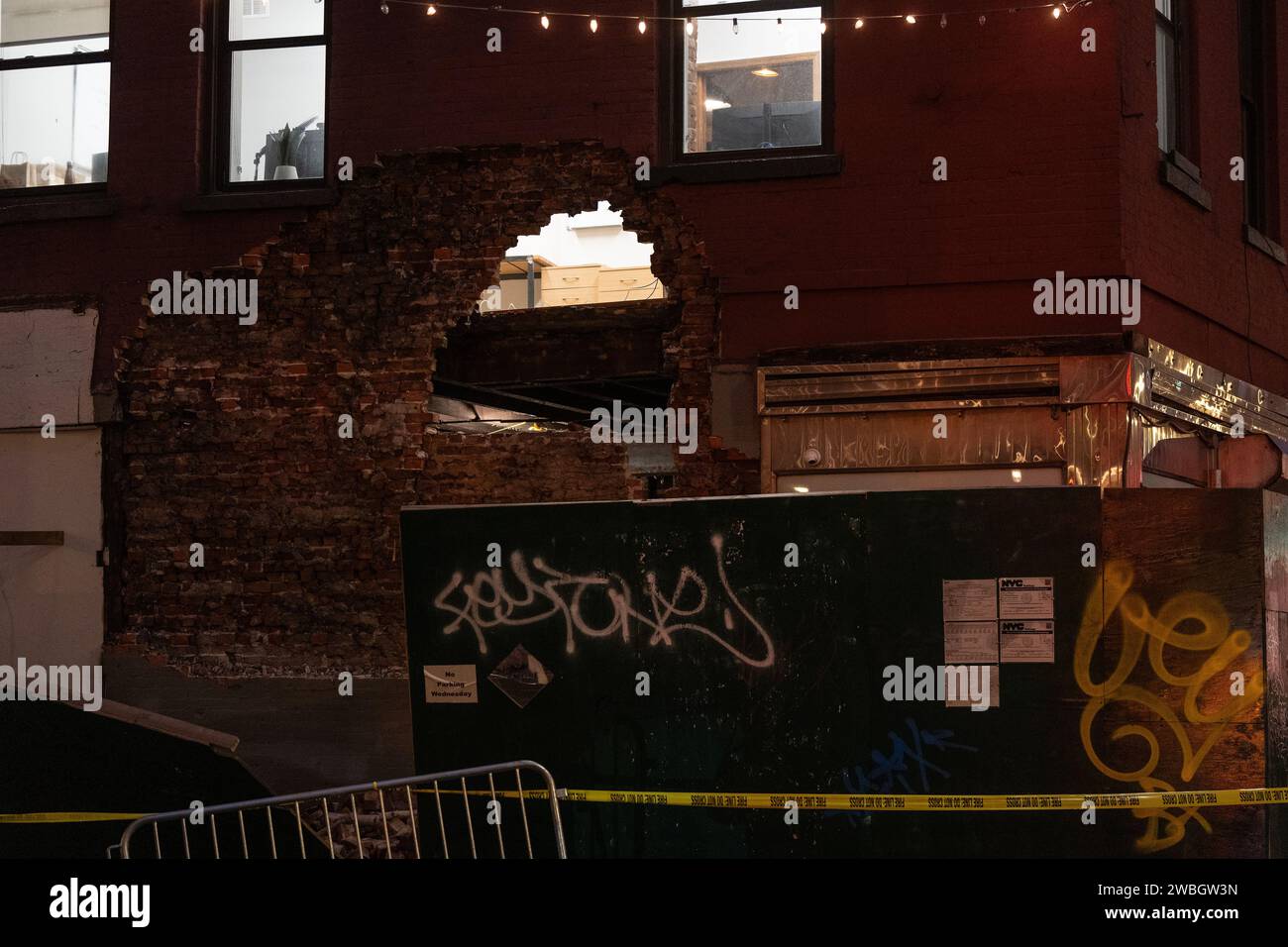 Partially collapsed exterior wall from a building on 188 Grand street ...