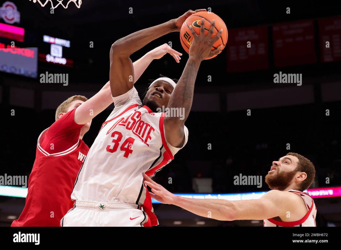 Columbus, Ohio, USA. 10th Jan, 2024. Ohio State Buckeyes center Felix Okpara (34) grabs a defensive rebound during the game between the Wisconsin Badgers and the Ohio State Buckeyes at Value City Arena, Columbus, Ohio. (Credit Image: © Scott Stuart/ZUMA Press Wire) EDITORIAL USAGE ONLY! Not for Commercial USAGE! Stock Photo