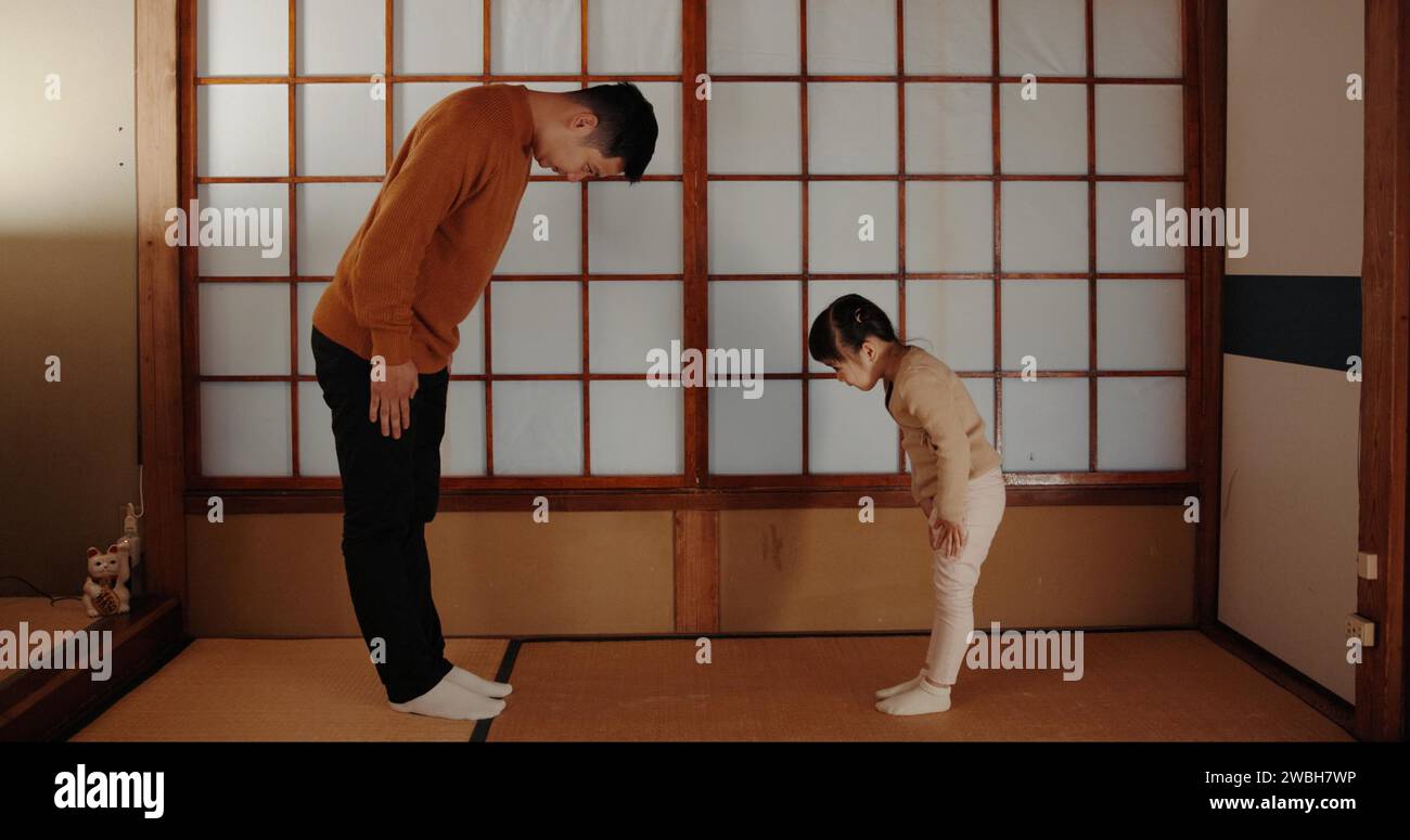 Traditional, home and Japanese father and child bow for greeting ...