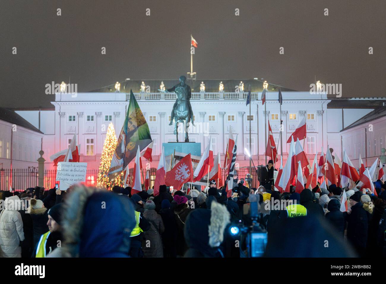 People Wave Poland S National Flags And Shout Slogans As They Rally   People Wave Poland S National Flags And Shout Slogans As They Rally Outside The Presidential Palace In Warsaw Poland On January 10 2024 Around A Hundred Of People Gathered Outside The Presidential Palace To Show Support To Lawmakers Maciej Wasik And Mariusz Kaminski Who Have Been Ordered By A Court To Go To Prison Both Mp S Have Been Arrested At The Presidential Palace Earlier This Evening Warsaw Poland Rally In Support Of Pis Mp S In Warsaw 20240110 Rally In Support Of Pis Mp S In Warsaw 20240110 Copyright Xmarekxantonixiwanczukx Mai09642 Enhanced Nr 2 2WBHBB2 