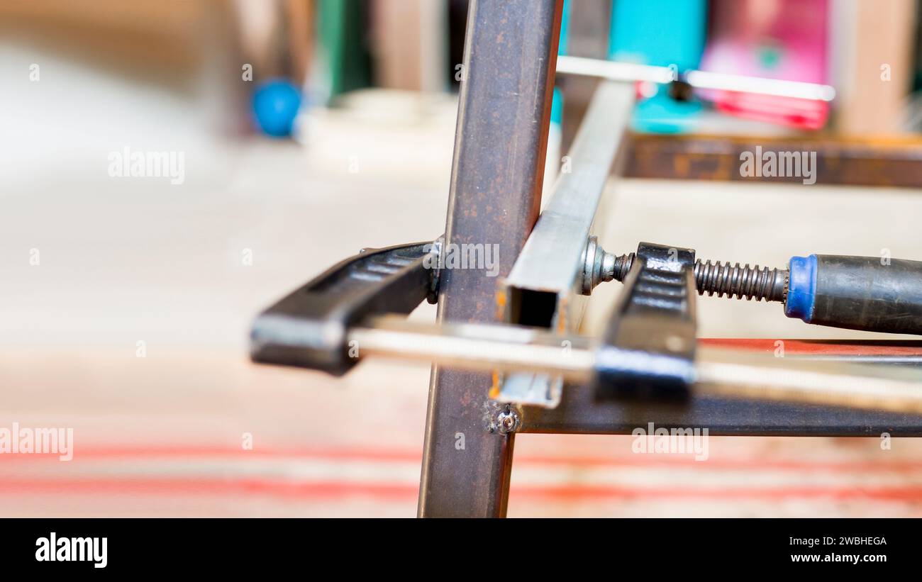 C-Clamp, C-shape workpiece, can be used both wood and steel. C-shape clamps, d.i.y concept Stock Photo