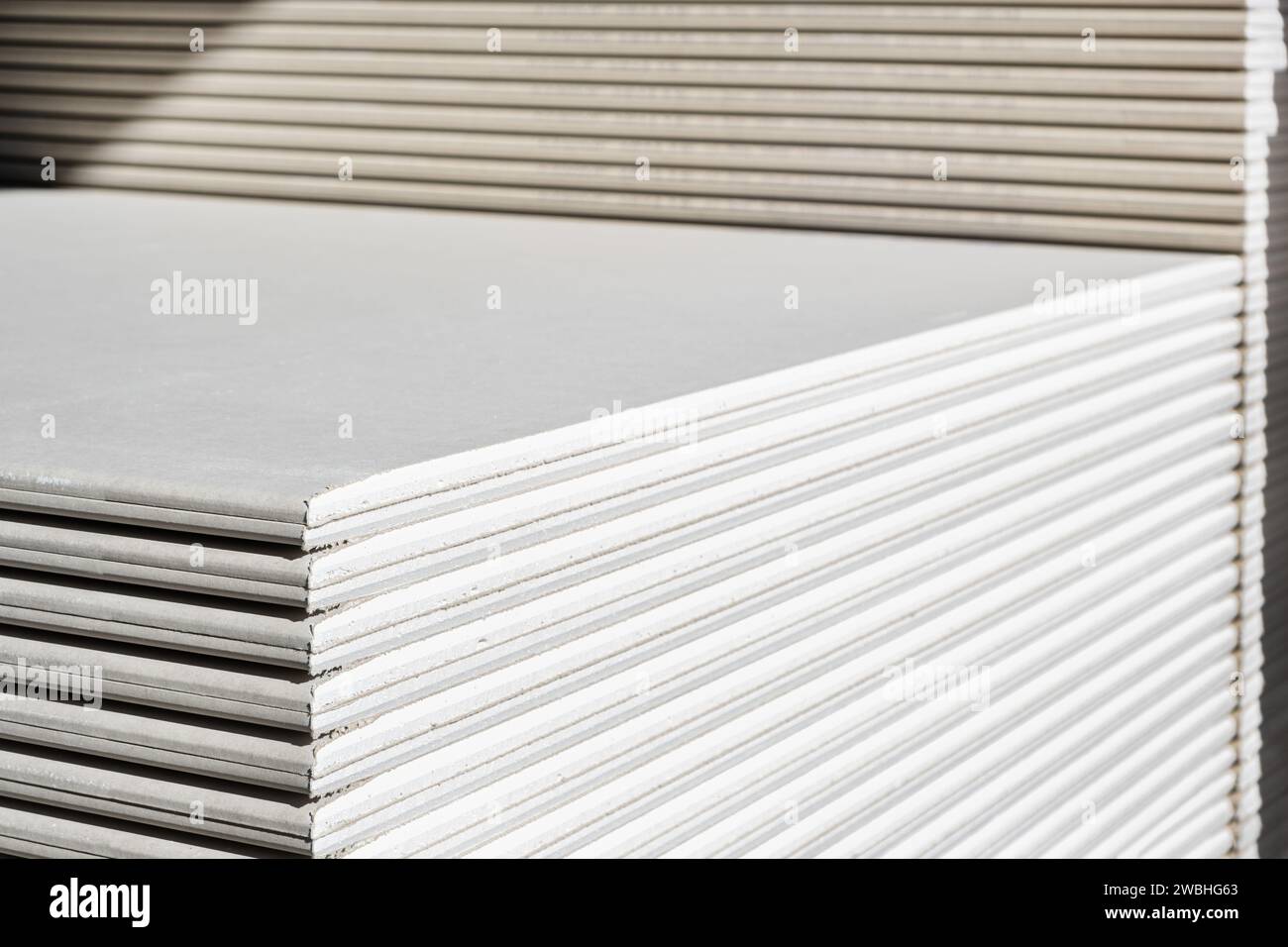 The stack of WHITE drywall Standard Gypsum board panel. Plasterboard