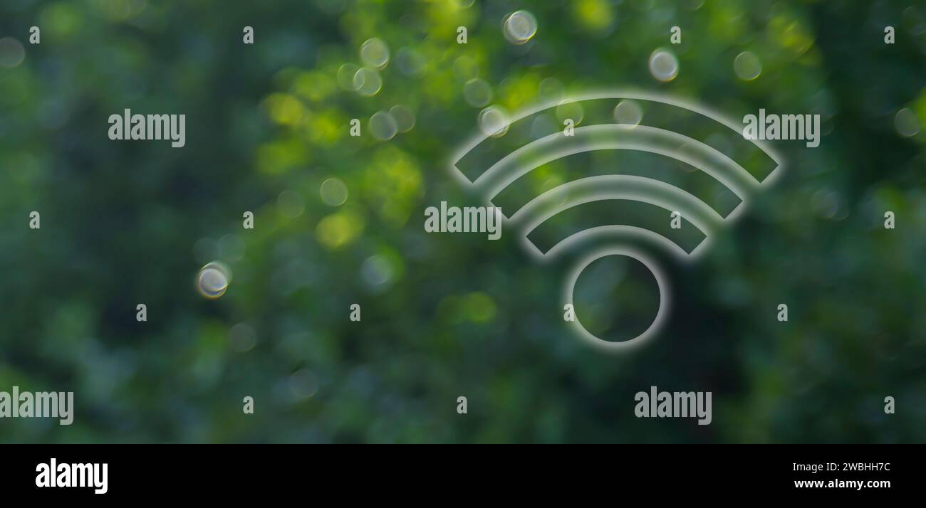 Wi-Fi symbol on bright green leaf background. Stock Photo