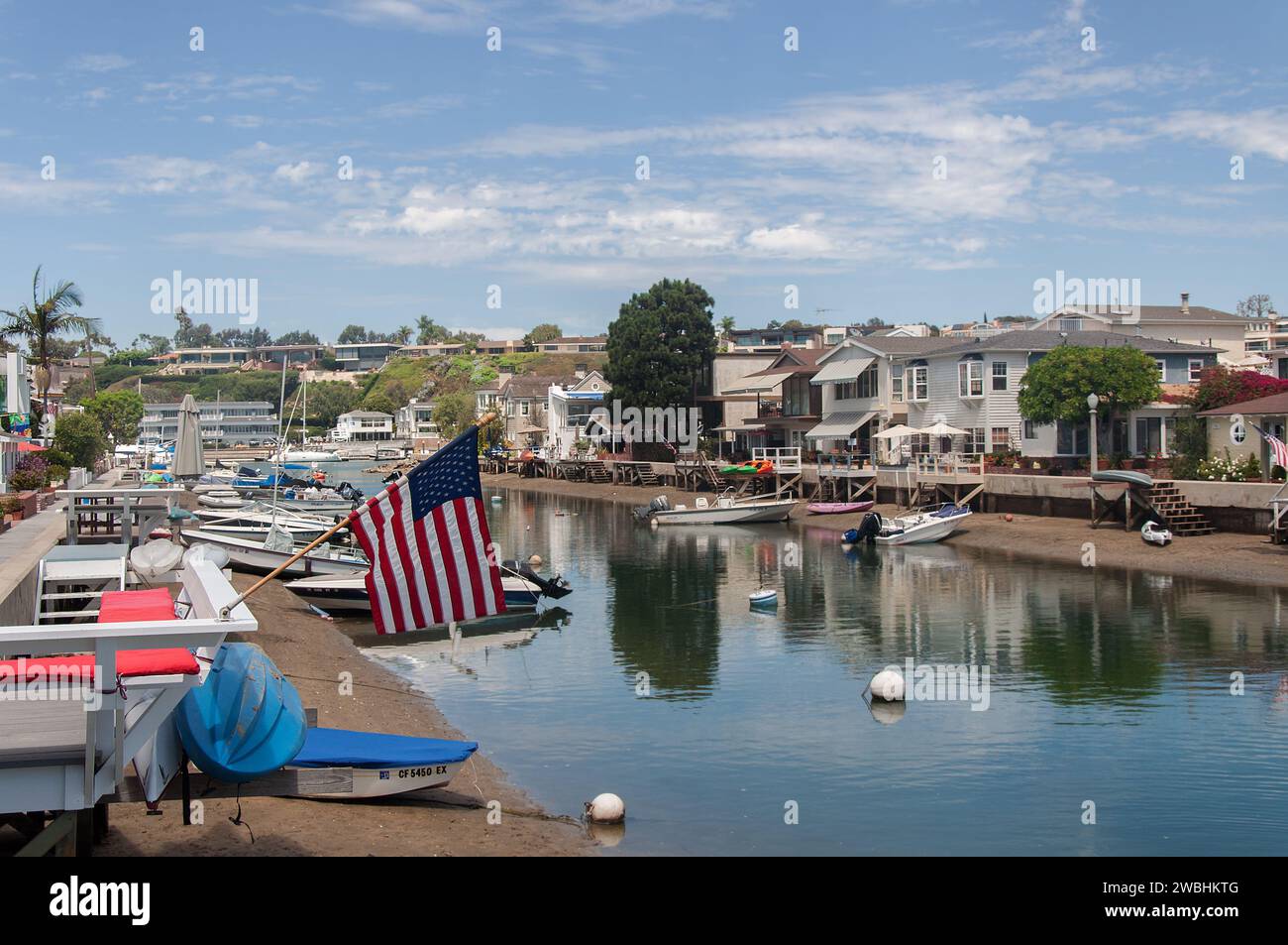 Newport Beach, California, USA - September 1, 2013. Balboa Island Grand Canal. Residential houses and boats Stock Photo