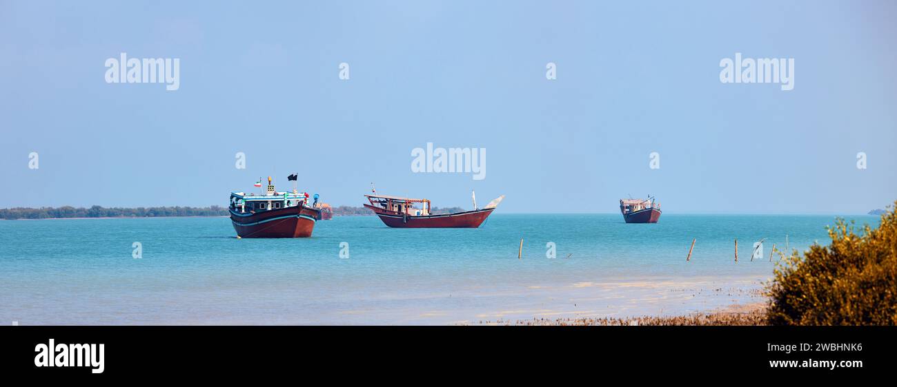 Traditional Dhow old wooden boat in the harbor of Iranian Qeshm Island ...