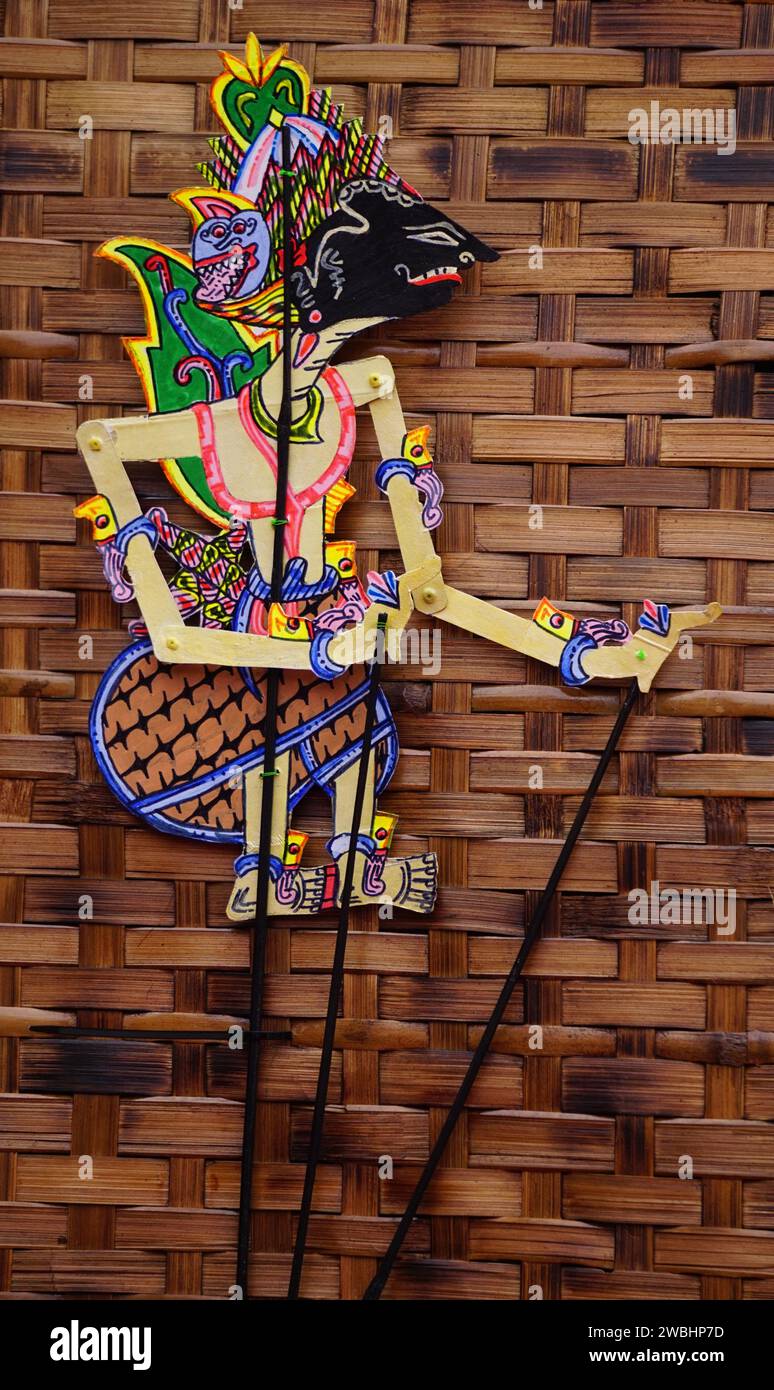 The indonesian puppets which called wayang (Javanese puppet) on white background. Wayang are made of goat, cow or buffalo skin Stock Photo