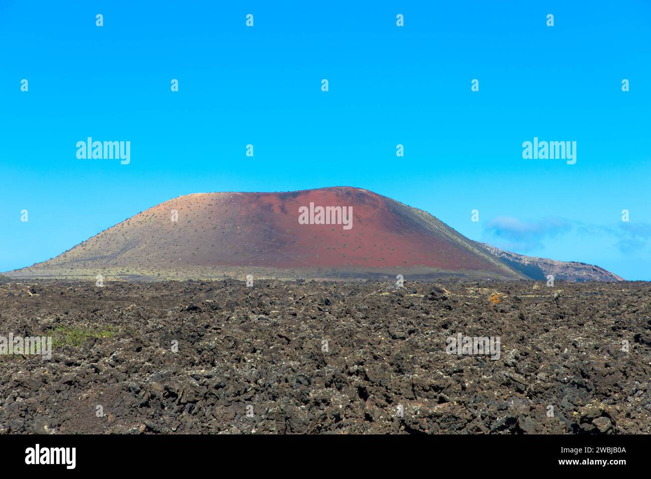 Spectacular views of the Fire Mountains at Timanfaya National Park, this unique area consisting entirely of volcanic soils. A Mars-like volcanic land. Stock Photo