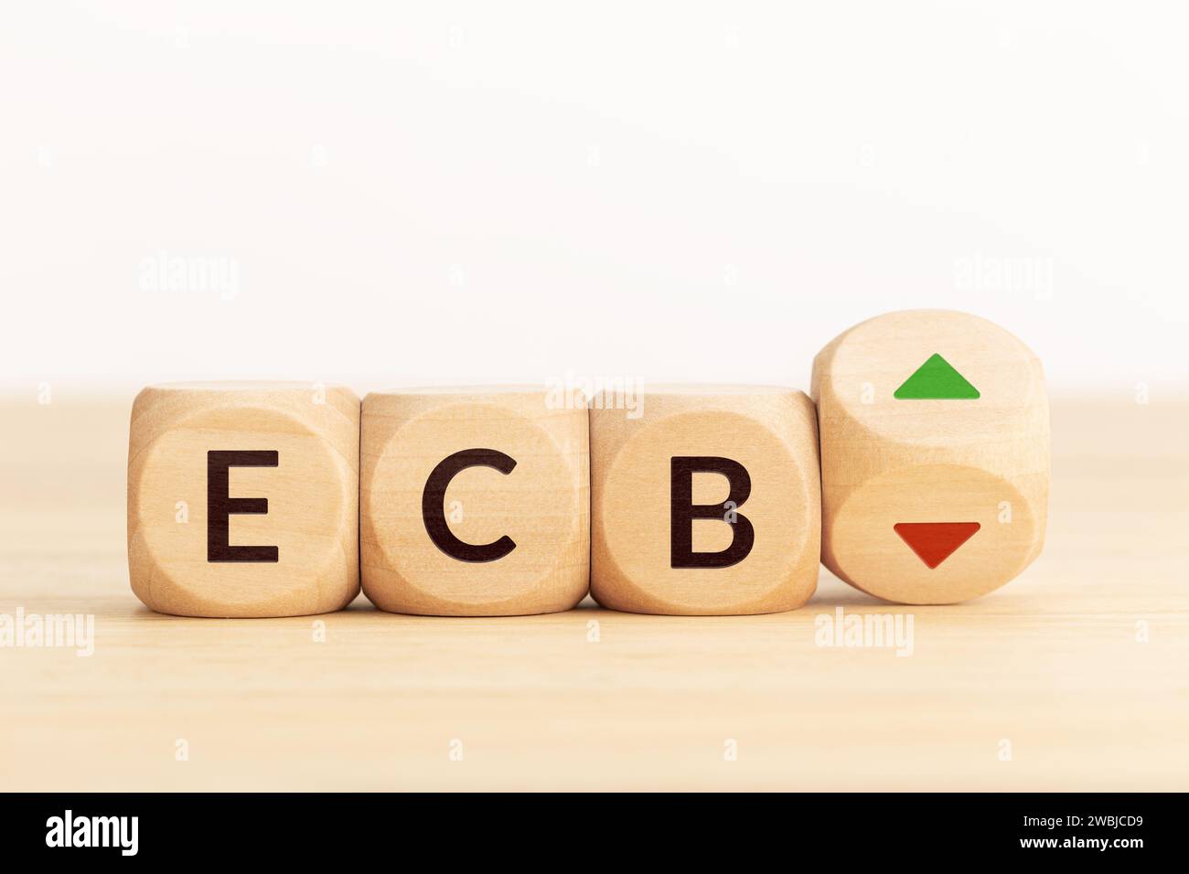 ECB or European Central Bank control interest rates raise or lower concept. Wooden blocks with text and arrows. Copy space Stock Photo