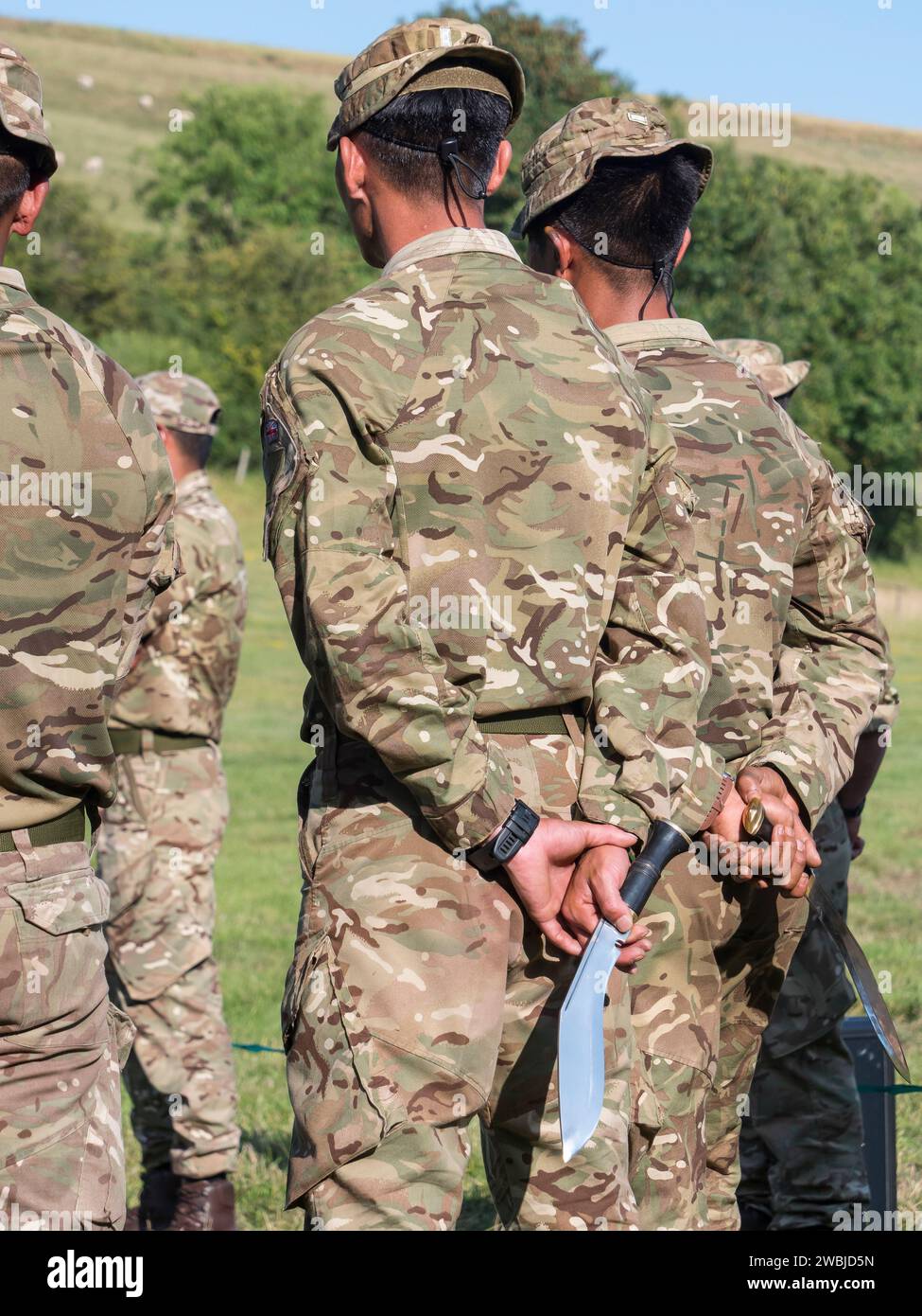 A Gurkha soldier holding his kukri knife behind his back, Chalke Valley history festival 2023 Stock Photo