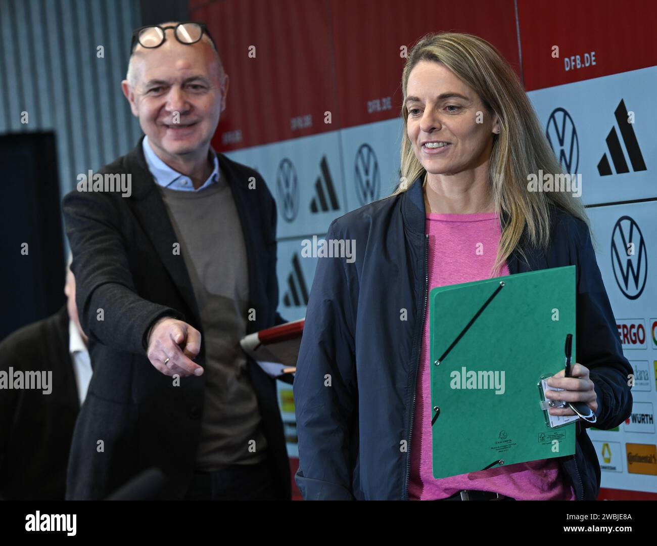 11 January 2024, Hesse, Frankfurt/Main: Nia Künzer (r), new DFB Sports Director for Women's Football, and Bernd Neuendorf, President of the German Football Association (DFB), attend a press conference at the DFB Campus. The 43-year-old former national team player from Wetzlar took up the newly created post on January 1. Photo: Arne Dedert/dpa Stock Photo