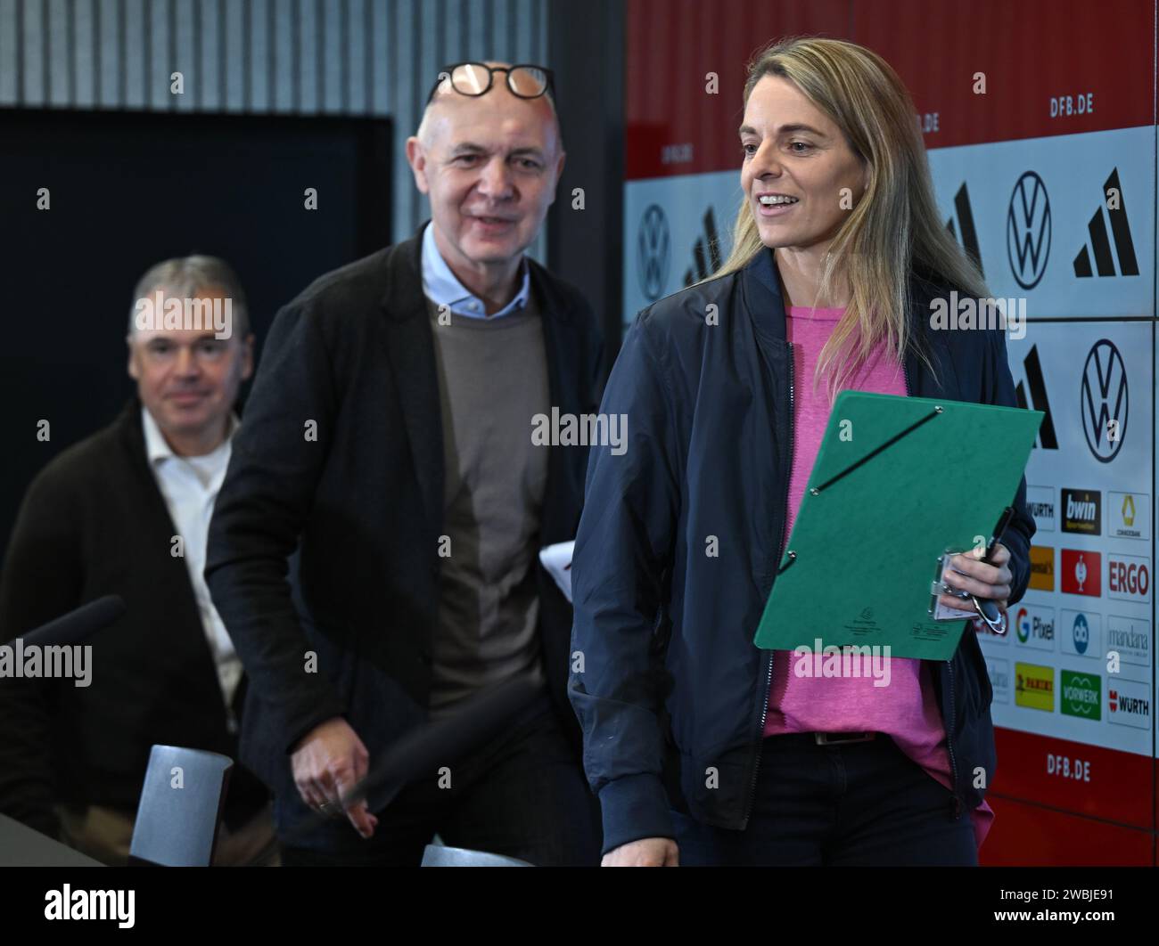 11 January 2024, Hesse, Frankfurt/Main: Nia Künzer (r-l), new DFB Sports Director for Women's Football, Bernd Neuendorf, President of the German Football Association (DFB), and Andreas Rettig, DFB Managing Director Sport, attend a press conference at the DFB Campus. The 43-year-old former national team player from Wetzlar took up the newly created post on January 1. Photo: Arne Dedert/dpa Stock Photo
