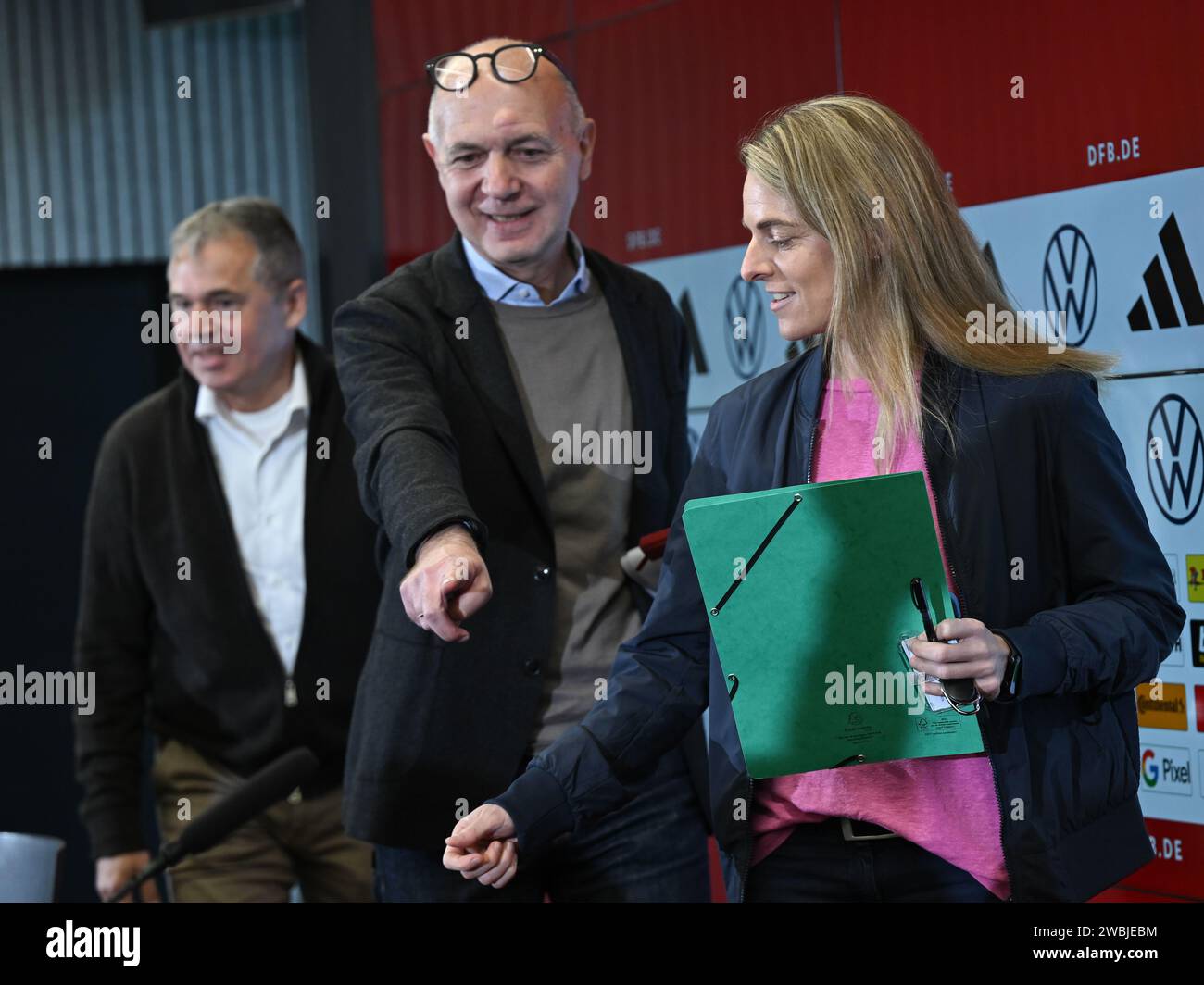 11 January 2024, Hesse, Frankfurt/Main: Nia Künzer (r-l), new DFB Sports Director for Women's Football, Bernd Neuendorf, President of the German Football Association (DFB), and Andreas Rettig, DFB Managing Director Sport, attend a press conference at the DFB Campus. The 43-year-old former national team player from Wetzlar took up the newly created post on January 1. Photo: Arne Dedert/dpa Stock Photo