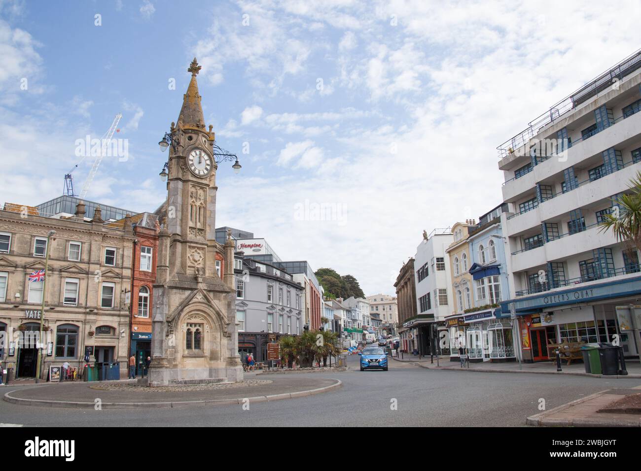 An old clock tower building on a roundabout in Torquay in the United Kingdom Stock Photo