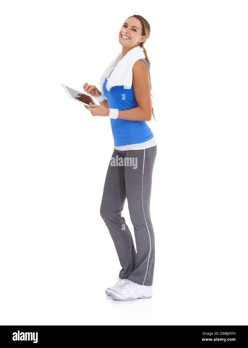 Woman, fitness and tablet in studio portrait for health data or results of workout, exercise and training progress. Sports model with digital Stock Photo
