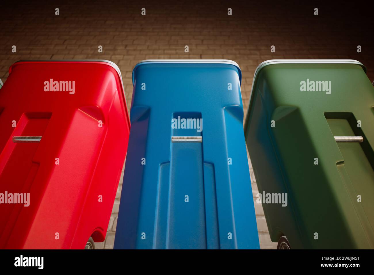 A lineup of vibrantly hued, red, blue, and green recycling bins with