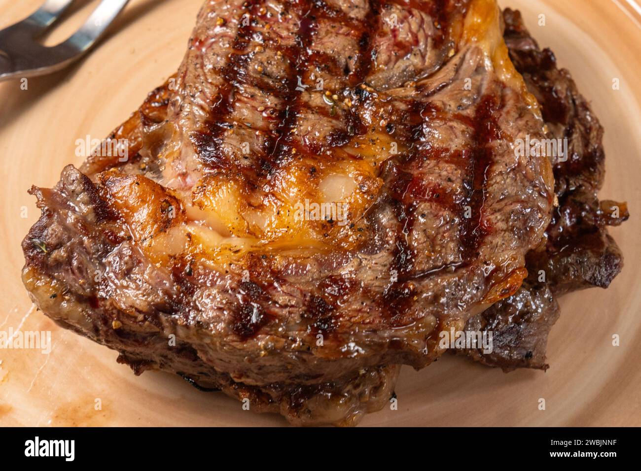 Succulent Grilled Steak on a Plate Captured. Selective focus Stock Photo