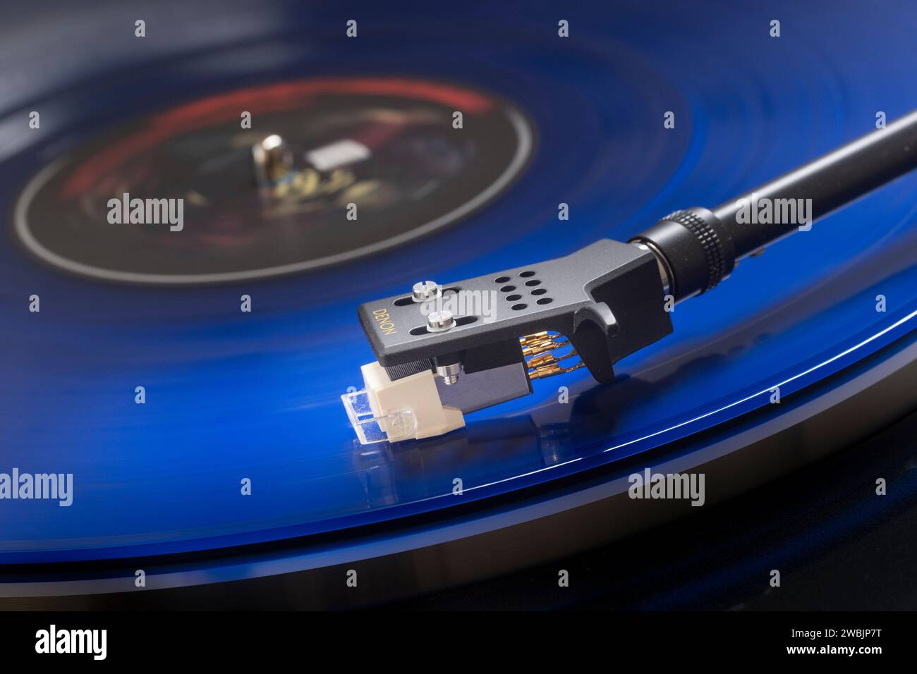 Record player with a blue long-playing record Stock Photo