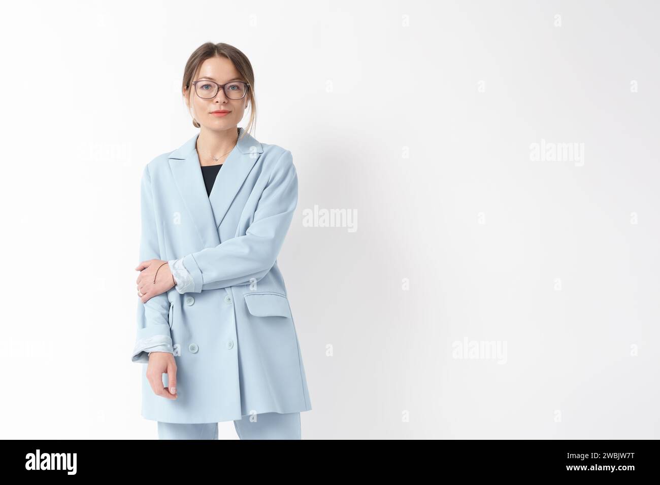 Chic Professional in Pastel Blue Blazer Stock Photo - Alamy