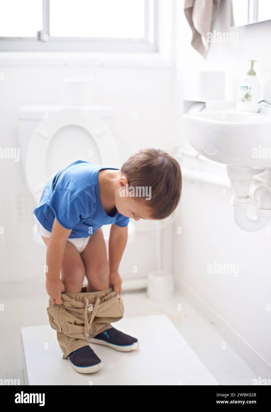 Child, bathroom and toilet training in diaper or learning growth, milestone or hygiene. Male