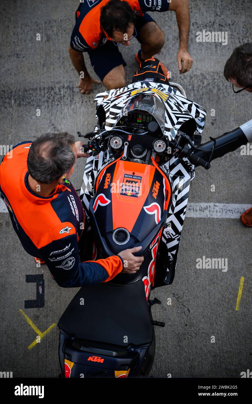 Top view of Brad Binder's KTM Red Bull bike in the pits before heading out for testing at the 2024 Test at the Valencia circuit in Spain. Stock Photo
