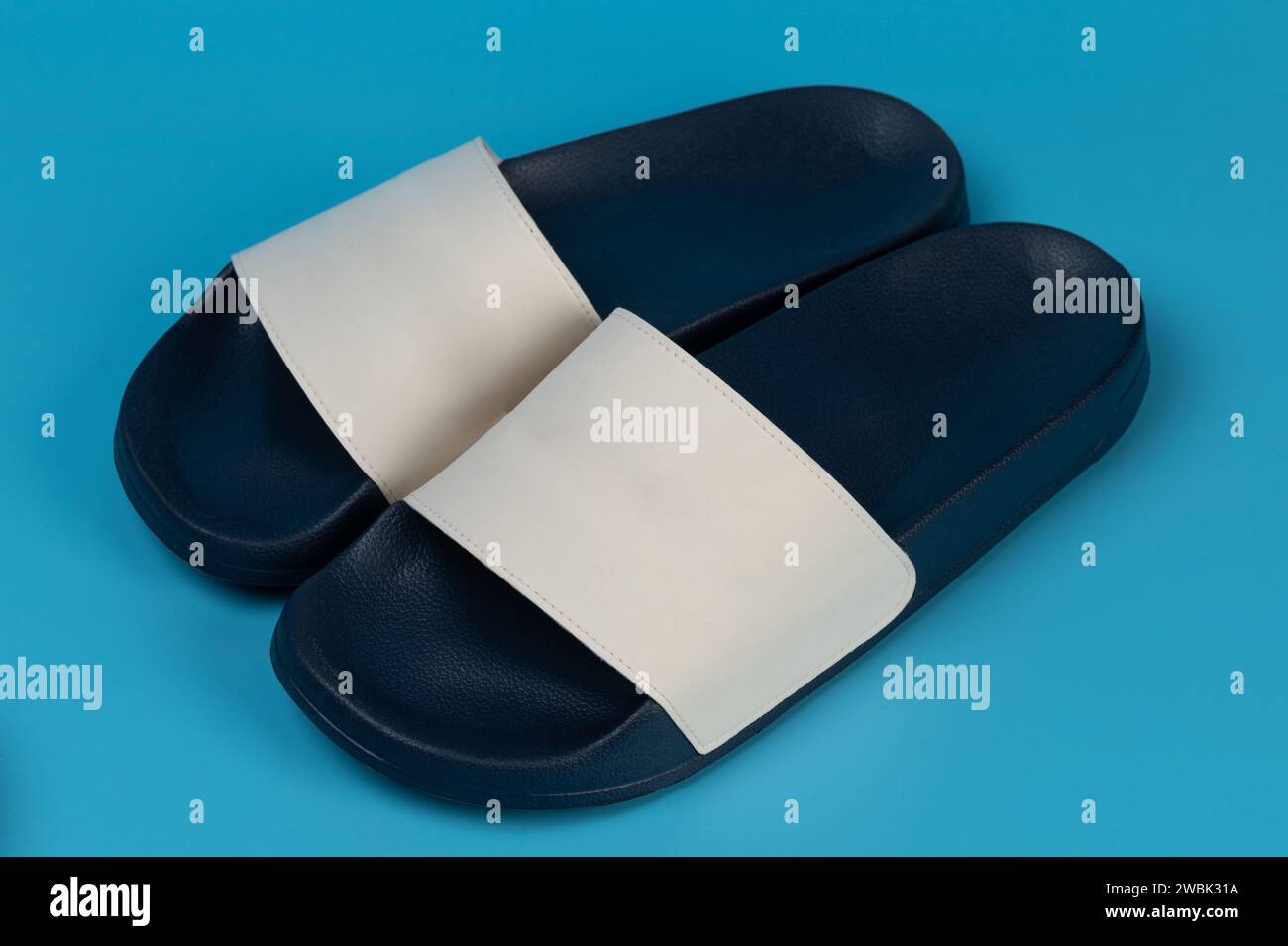 Pair of blue comfortable slippers with white top isolated Stock Photo