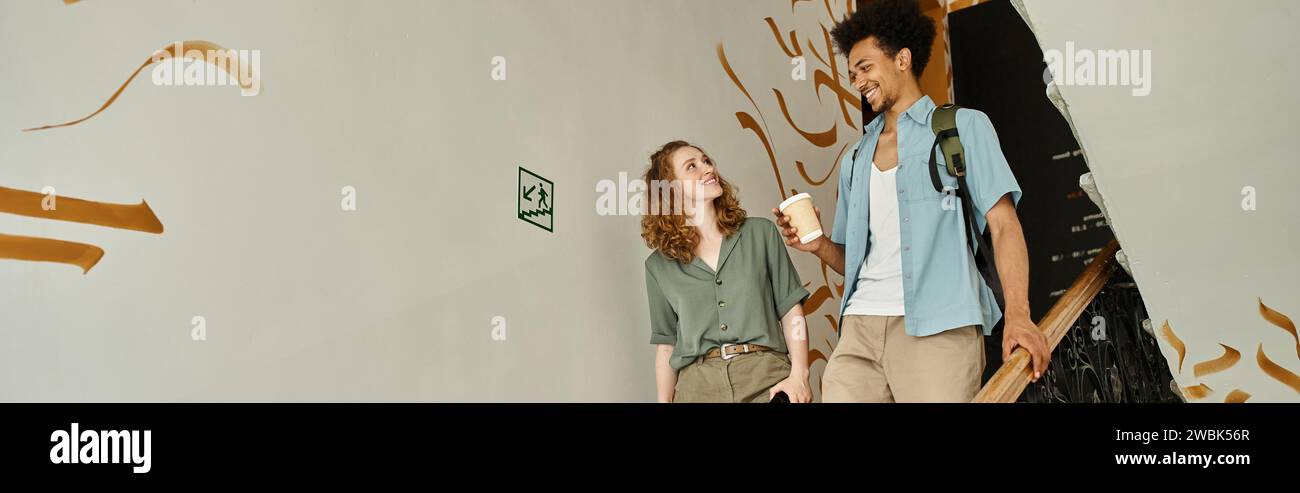 carefree african american man with paper cup walking with girlfriend on ...