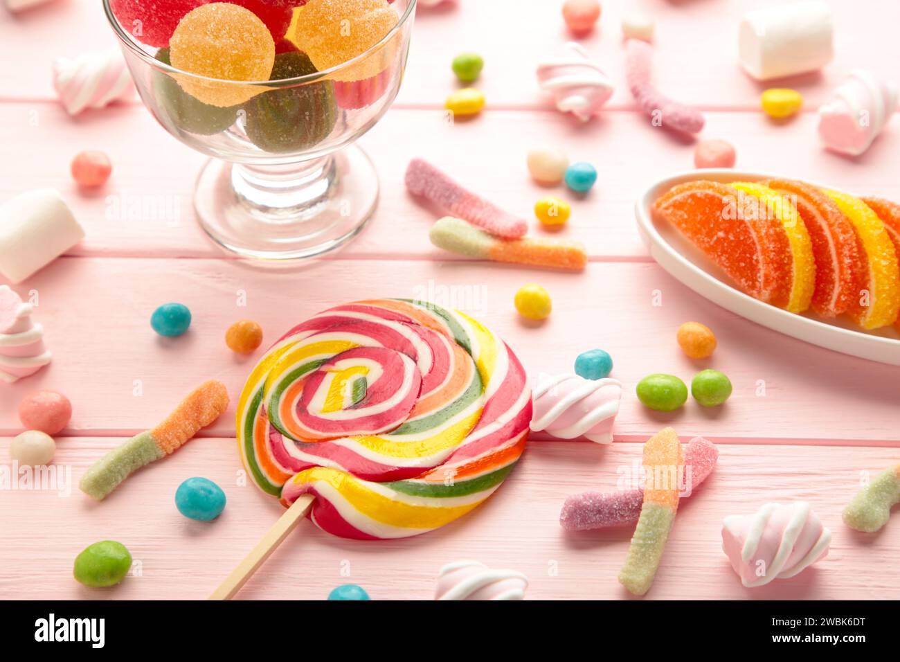 Colorful candies lollipops and jelly on pink background. Top view Stock ...