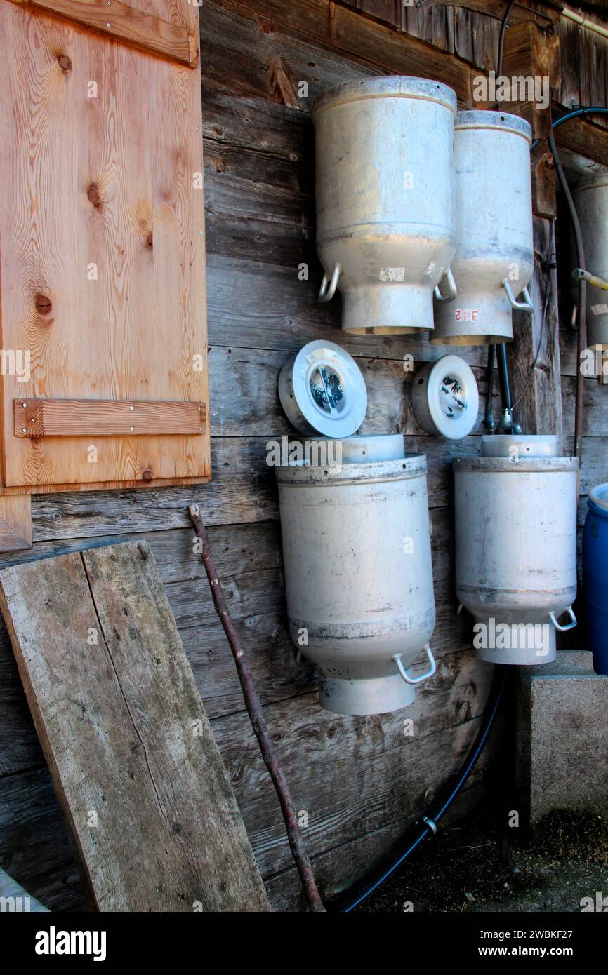 Milk cans hung up to dry and ventilate on the Lochalm, Bächental, Eben am Achensee municipality, Tyrol, Austria Stock Photo