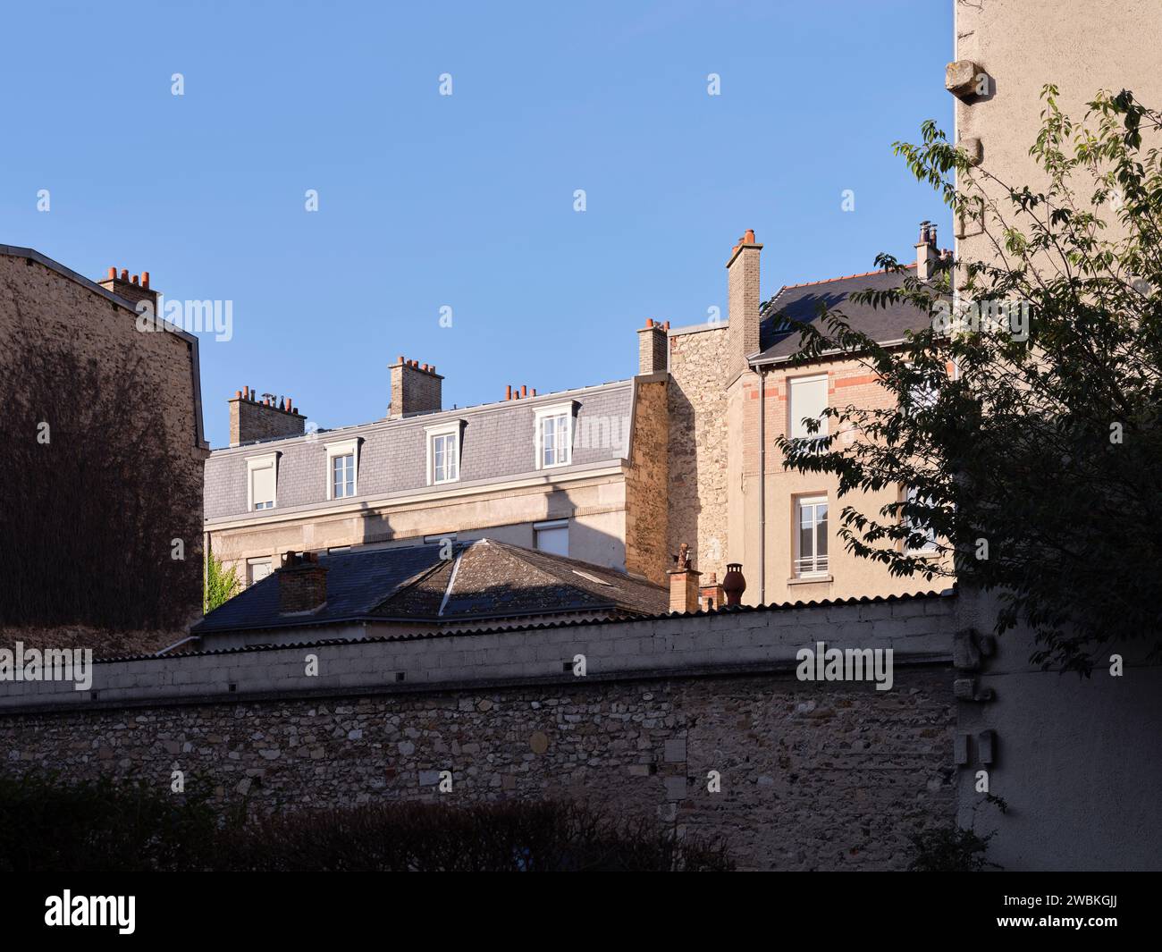 Houses in the sun in a backyard in Reims - Grand Est, Département Marne, France Stock Photo