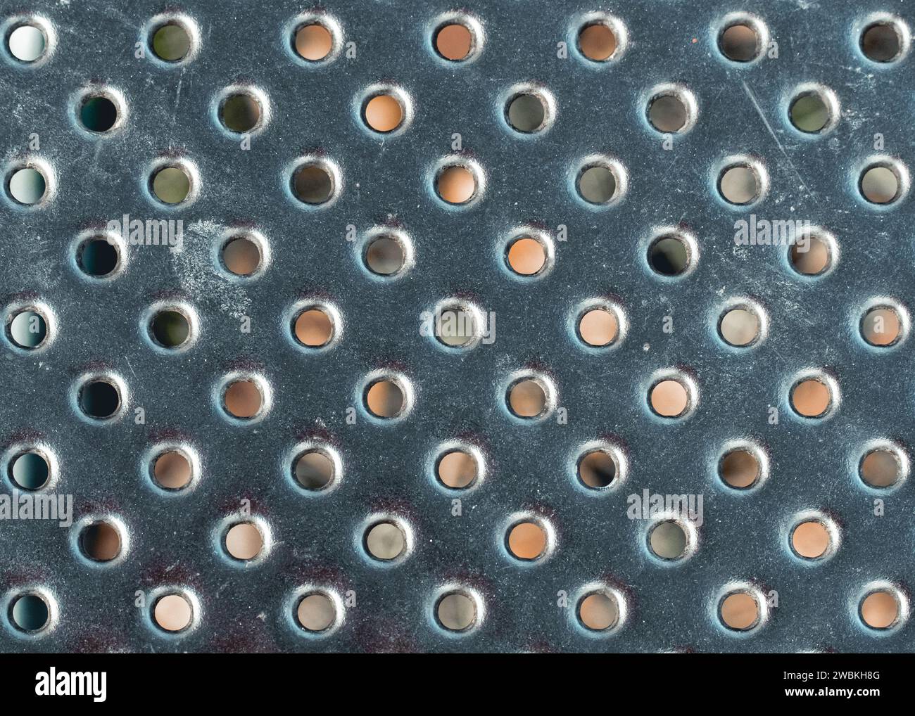 Grey steel table top with geometric circle holes Stock Photo