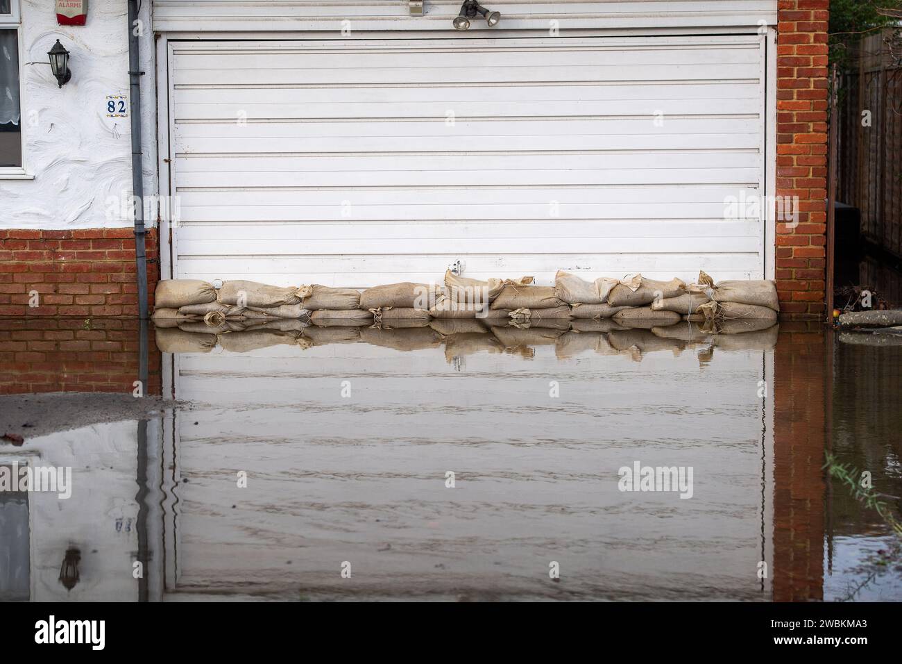 Wraysbury, UK. 11th January, 2024. Some gardens remain flooded in