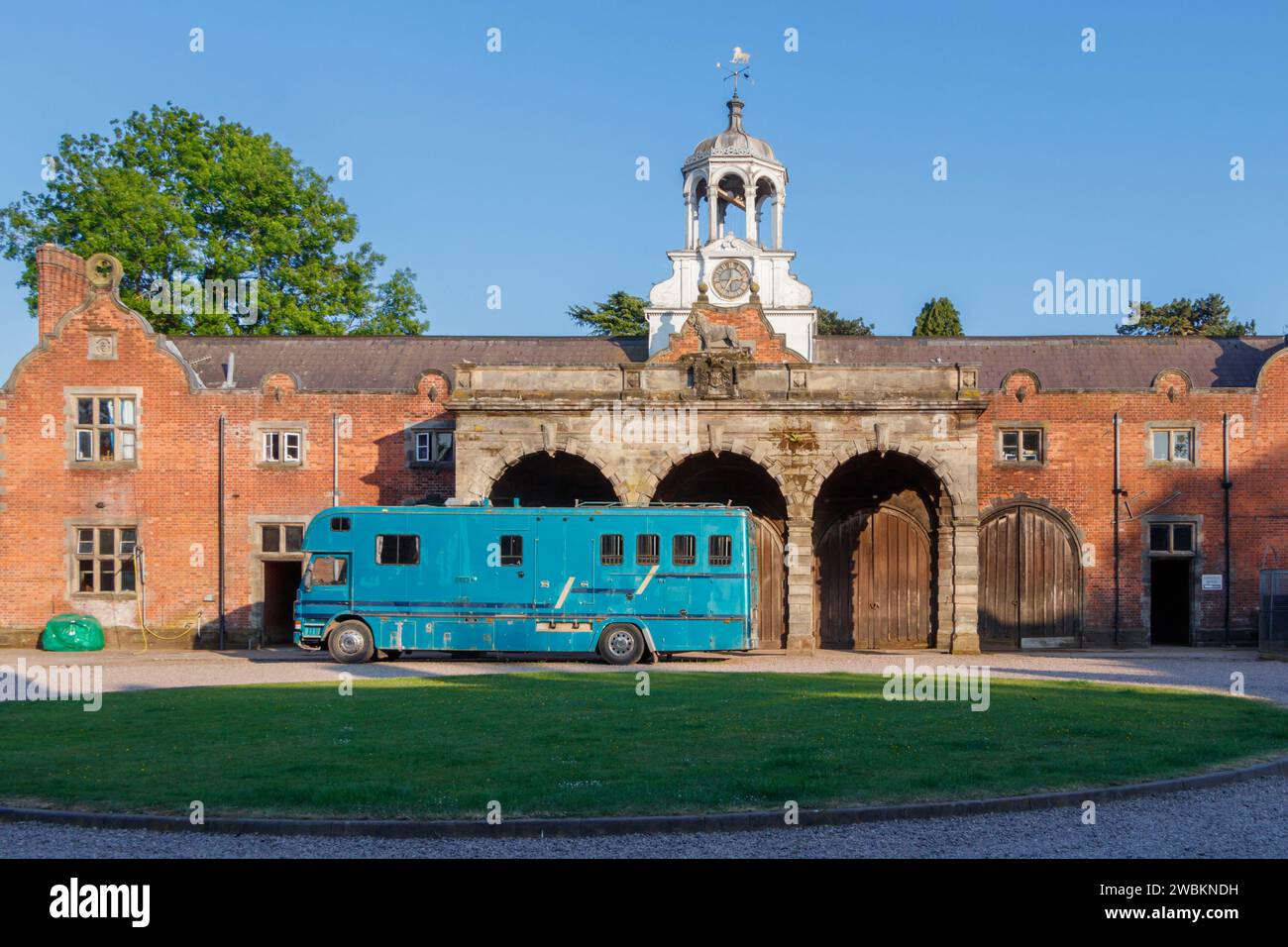 blue horsebox trailer truck parked outside ingestre hall stables in stafford staffordshire Stock Photo