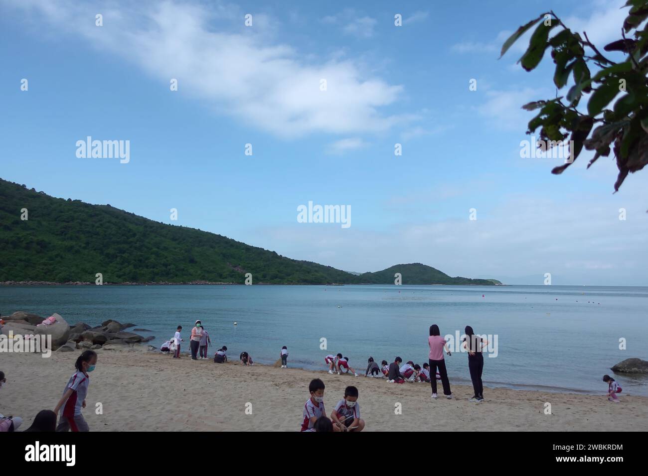 Hong Kong, China - July 12 2022: People play in Hoi Ha Wan beach in Sai Kung, Hong Kong. Stock Photo