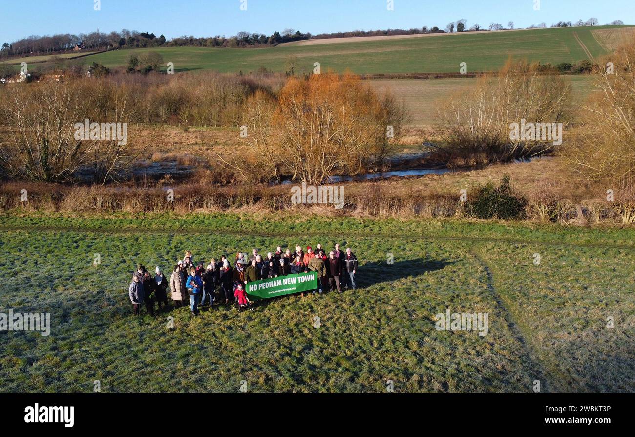 Members of the No Pedham New Town group stand beneath the site of a proposed garden city development at Pedham Place Golf Course in Swanley, Kent, which sits on green belt land atop of the hill above their homes in the villages of Eynsford and Farningham. Local communities are being pitted against each other 'like the Hunger Games' in a planning vote over where thousands of new homes could be built on green belt land. Picture date: Thursday January 11, 2024. Stock Photo