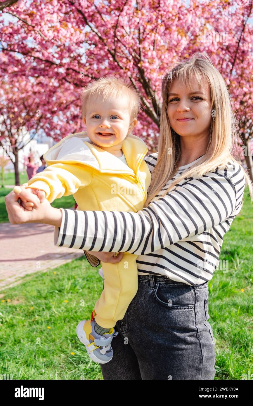 Mother holding baby under arms hi-res stock photography and images - Alamy