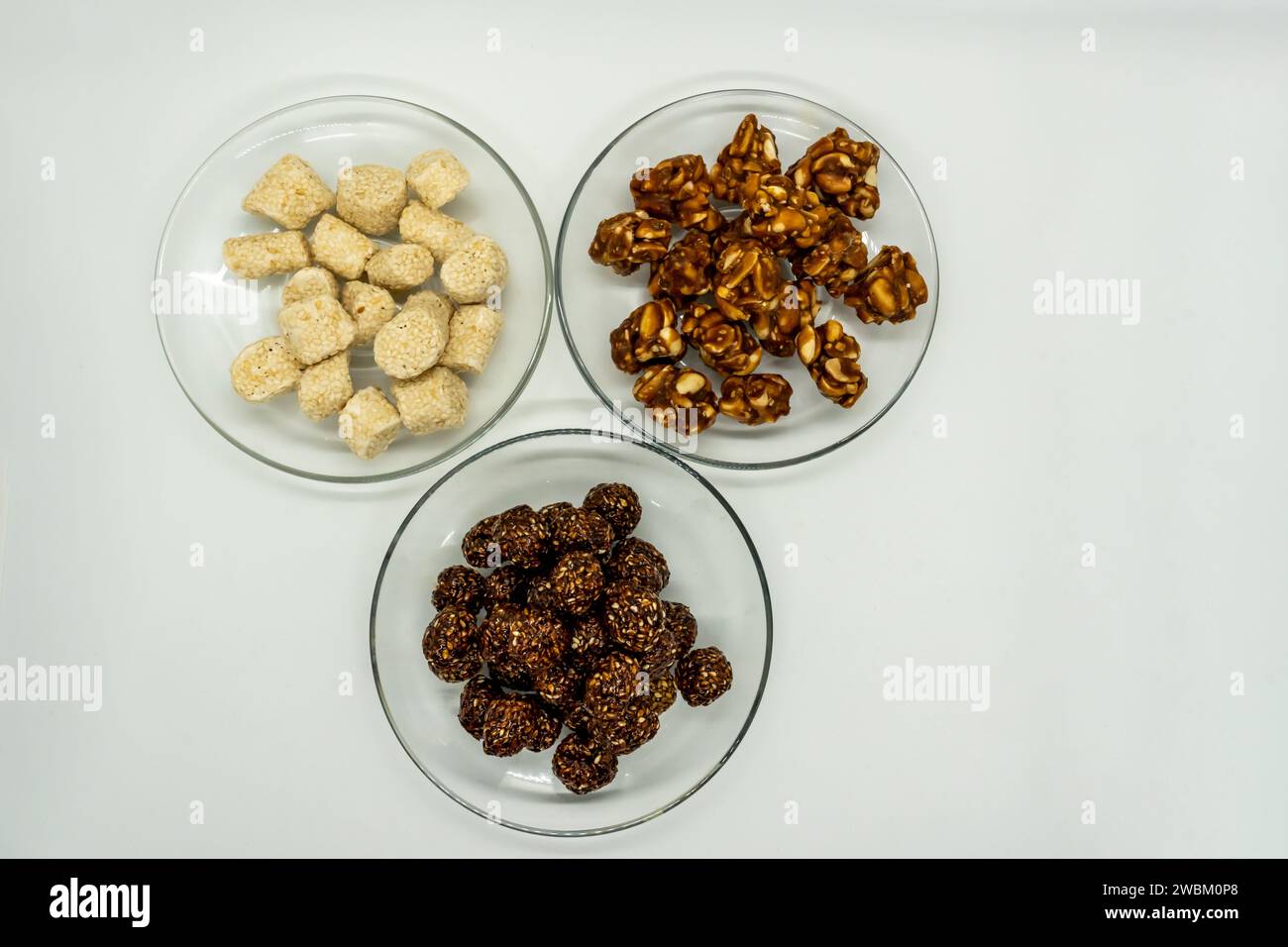 Three Plates Full of Sesame Ladoo, Til ko Laddu, Jaggery Peanuts Laddoo